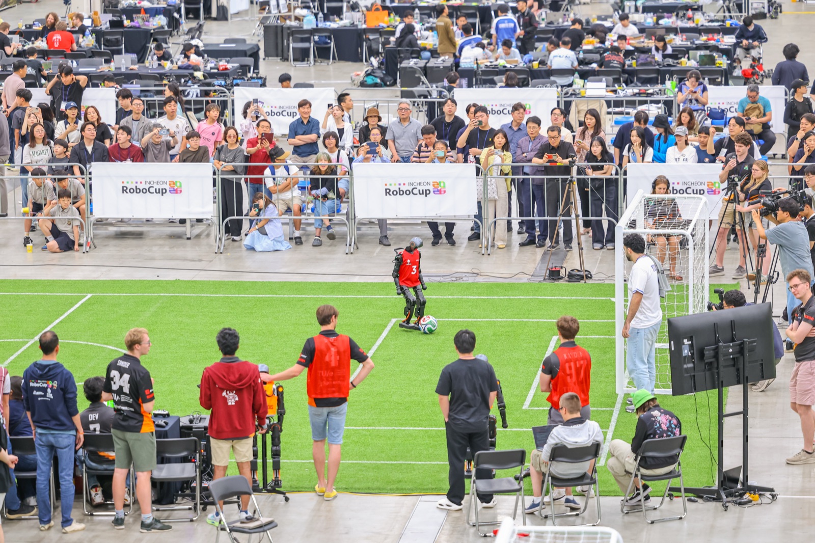 A humanoid testing on the field at RoboCup 2026, Incheon — autonomous, and less finished than it looks.